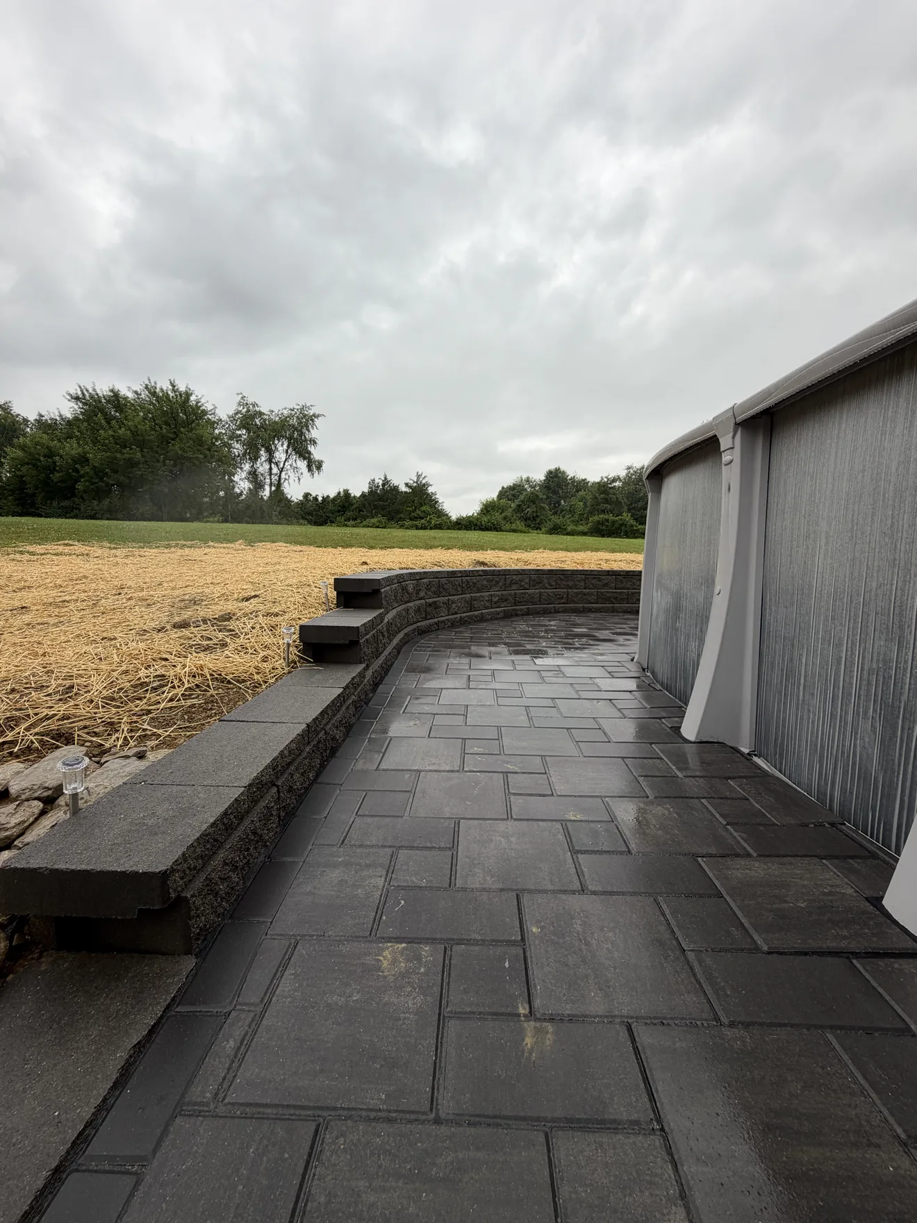 Block retaining wall with built in steps up to the reseeded yard in Lebanon, OH