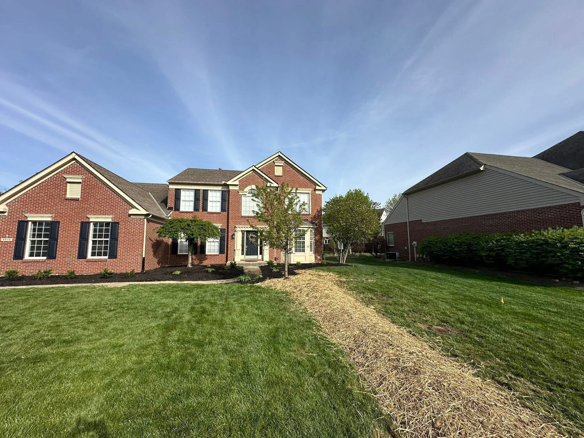 French drain installation correcting yard drainage issues in Mason, Ohio by Shawn’s Landscape & Design.
